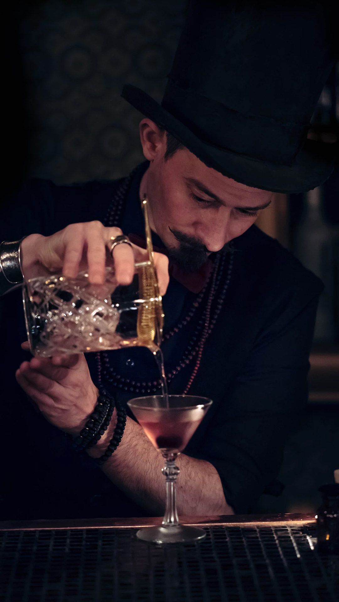 Mixologist Pouring Cocktail